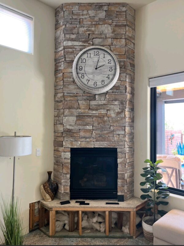 Fireplace before drywall repair in Marana