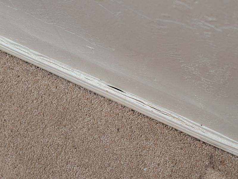 Wall restoration before photo with trim damage