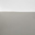 Settling drywall damage repaired with straight paint lines after photo