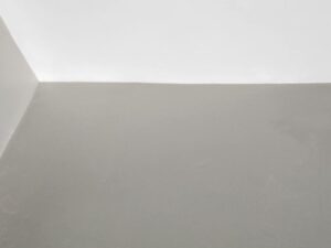 Settling drywall damage repaired with straight paint lines after photo